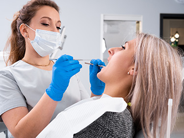 Lady At Dentist Having a Composite Filling
