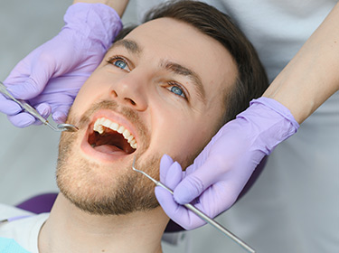 Man at Dentists having a filling