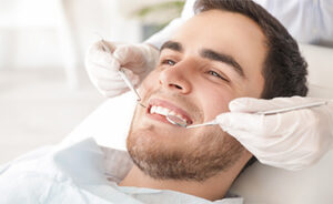 Man Smiling Having Dental Fillings Done in Turkey